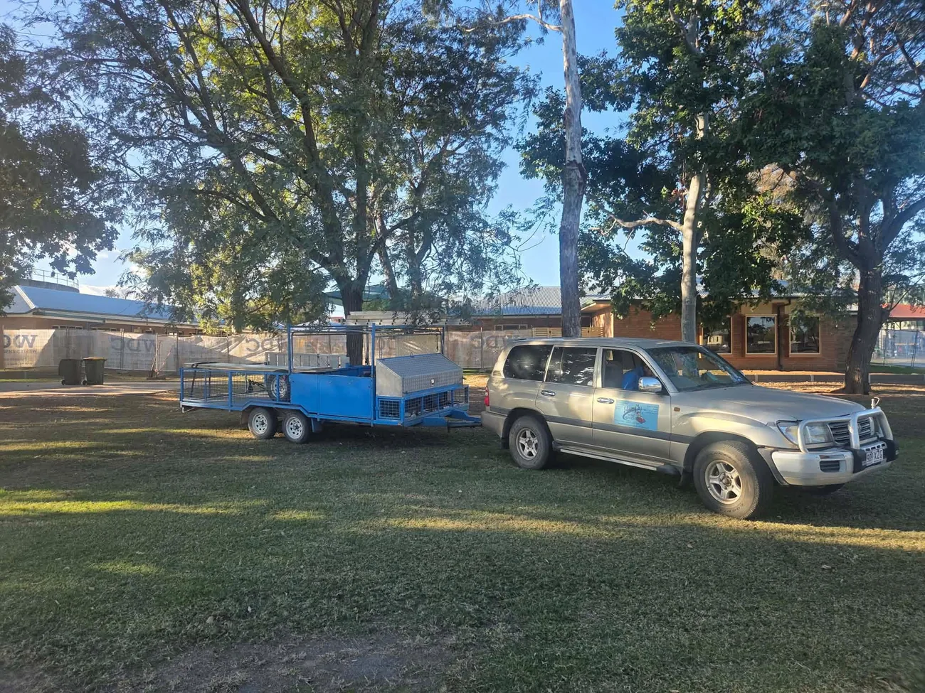 Hairy's work vehicle and trailer at a property